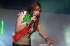 Nancy Ajram : Nancy Concert in Beirut wearing the lebanese flag on her shoulder