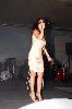 Nicole Saba : nicole wearing a short white dress on stage at a concert