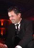 Ragheb Alama : in a black suit on stage singing live for his audience