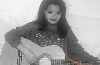 Tila Tequila picture when she was a child with an accoustic guitar