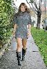 wallpaper of Tila Tequila walking back home in a short highneck gray knit dress