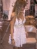 Tila Tequila wearing a white glittery short dress