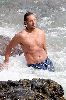 Josh Holloway : Josh swimming topless Davidoff photo