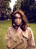 Carla Bruni Sarkozy : large picture of carla in a windy day wearing a light brown coat