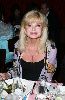 Loni Anderson : Loni Anderson on the table of the fundaraiser charity gathering