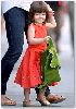 Suri Cruise : the lime green jacket seems to go perfectly with her orange junior GAP dress