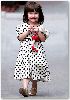 Suri Cruise : a bunny and a black dotted white dress