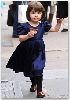 Suri Cruise : dark blue dress and offcource a chocolate cupcake