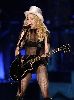 Madonna : madonna on stage live playing her guitar