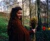 Claudia Christian : Claudia Christian on the set at a forest it seems