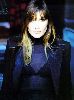 Carla Bruni Sarkozy : black suit jacket and a show-through shirt