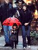 Suri Cruise : Suri holding her red lady-bug cute umbrella accompanied by her mother katie holmes and the bodyguards