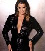 Claudia Christian : wearing a black leather suit