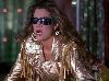 Claudia Christian : still from a movie wearing black sunglasses and a shiny old-fashioned golden jacket