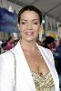 Claudia Christian : latest picture of Claudia looking stylish in a white suit jacket over a large v-shaped golden top