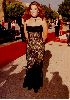 Claudia Christian : on the red carpet wearing a layered black knit dress