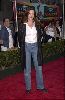 Claudia Christian : on the red carpet in a simple blue denim pants