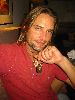 Josh Holloway : showing off his S sign necklace, looks like sawyer is a superman fan after all