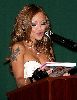 Tila Tequila : on stage reading from her new book Hooking Up with Tila Tequila on December 10th, 2008