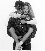 Amanda Peterson : a large photo hugging actor Patrick Dempsey