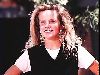 Amanda Peterson : a white tshirt under a black v-neck vest