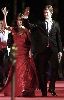 Kivanc Tatlitug : on the red carpet with turkish actress Songul Oden wearing a red glam dress