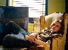 Michael Pitt : laying in a yellow Armchair and Smoking Cigarette