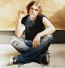 Michael Pitt  poster wearing denim pants and smoking a cigerrette