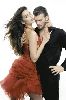 Azra Akin in a stylish red dress hugging her boyfriend Kivanc Tatlitug