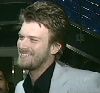 Kivanc Tatlitug smiling at a TV interview