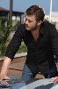 Kivanc Tatlitug wearing a black shirt