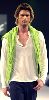 Kivanc Tatlitug wearing a lime green scarf