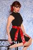 Roula Saad Stylish red-ribbon belt on a black dress