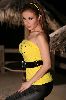 Roula Saad stylish yellow top and large leather black belt