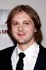 Michael Pitt wearing a neck tie and a black suit