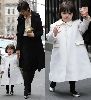 Suri Cruise in a stylish white coat