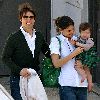 Suri Cruise with mom and dad at an early age