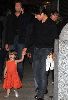 Suri Cruise holding her Dad's hand walking on the street