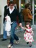 Suri Cruise weaing a floral red dress