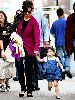 Suri Cruise wearing a summer blue dress