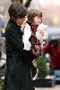 Suri Cruise in a white fluffy jacket