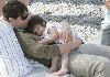 Suri Cruise sleeping on Dad's chest