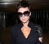 VICTORIA BECKHAM : seen arriving at LAX airport, wearing large black sunglasses and a leather on the 6th of December of 2008