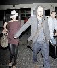 VICTORIA BECKHAM : and David Beckham land at the Bradley International Terminal of Los Angeles International Airport, both looking tired after taking a British Airways flight from London - Copy