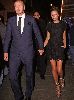 VICTORIA BECKHAM : David wearing an elegant navy suit with his wife Victoria who is wearing a weird high heels golden shoes