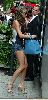 VICTORIA BECKHAM : wearing a stylish open-toe beige high heels and a mini denim shorts