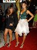 Rihanna : posing on the red carpet wearing a fluffy white layered skirt and a green open-chest top at the 2005 world music awards