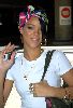 Rihanna wearintg a colorful hair bandana