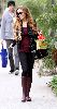 Lindsay Lohan : spotted shopping yesterday 3rd January 2009 wearing a tight black leggings and maroon stretch top and a dark maroon long low-heel boots