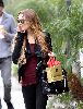 Lindsay Lohan : new candids smoking at the street while shopping yesterday 3rd of January 2009